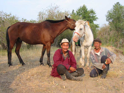 Mongols with their horses