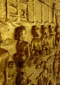 Wall sculpture of Buddhas made of stucco and painted at Wat Mai