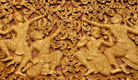 Ramayana scene on outside wall at Wat Xieng Thong